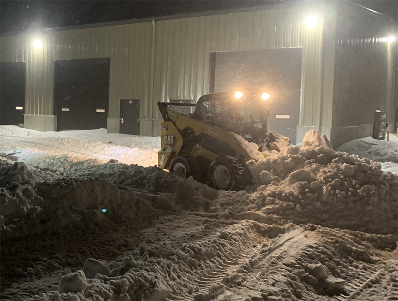 Commercial Storage Lot Being Plowed